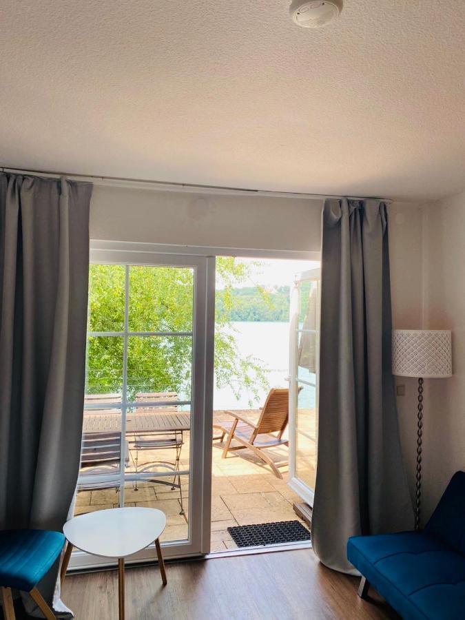 Dreibettzimmer mit Terrasse und Seeblick