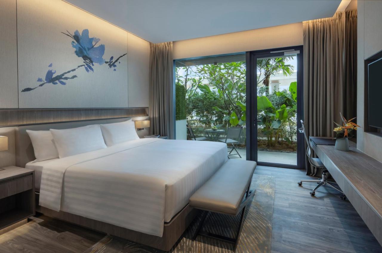 Hébergement Lit King-Size Deluxe Laguna avec Terrasse - Côté Ville