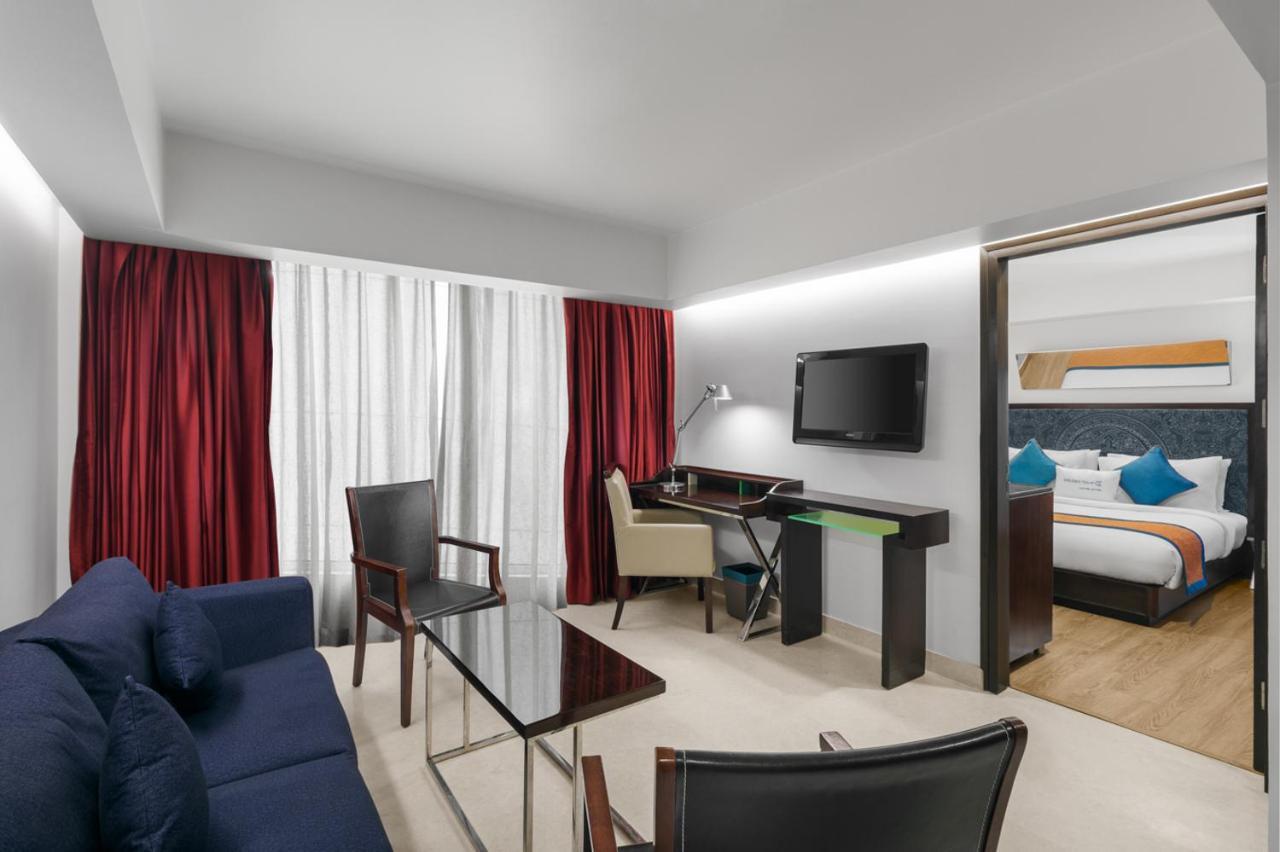 Junior Suite - 1 King Bed with Happy Hours-1+1 offer on Alcoholic Beverages, 15% Off on Laundry service, Complimentary In-Room Refreshments featuring Cookie Platter , 15% off on Food & Beverage services