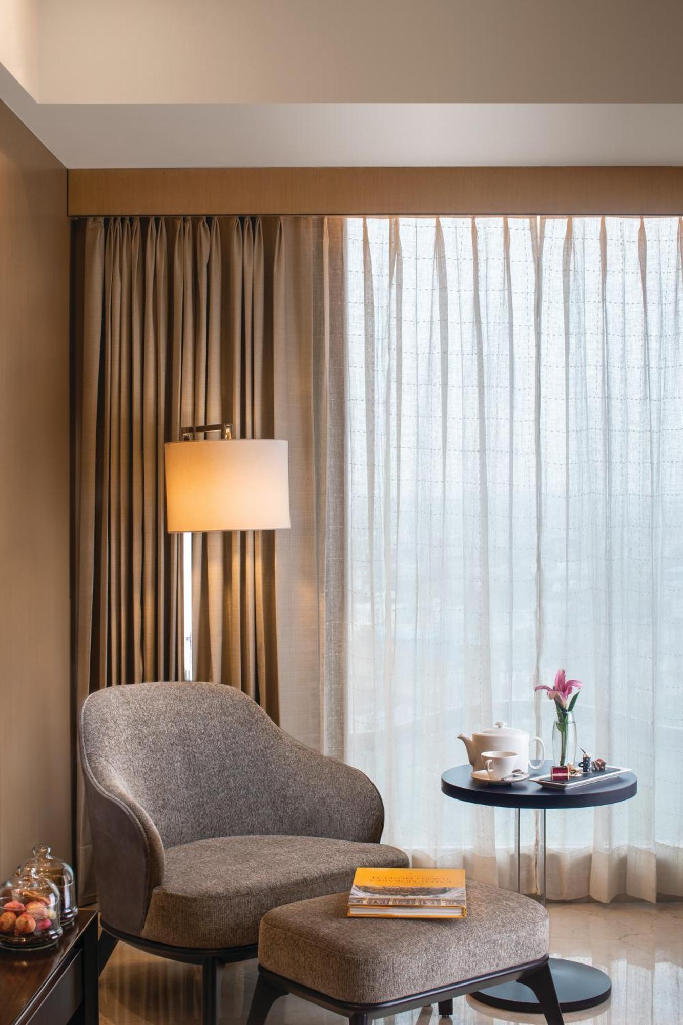 Executive Room with alcoholic / non - alcoholic house drinks , a platter of Fruits and Cookies , 01 way airport transfers, 10% off on food & soft beverages, complimentary sauna and steam once during the stay, ( early check in and late check out by 4 