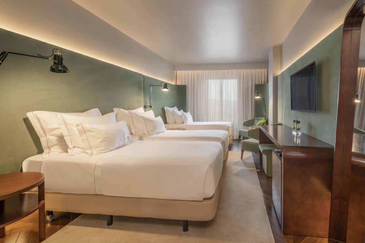 Quarto Triplo com Vista Cidade