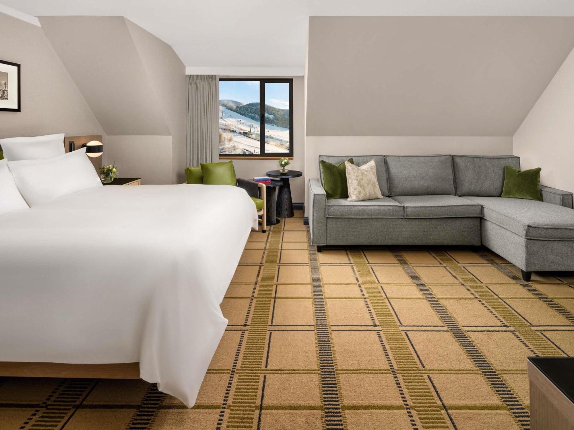 Habitación Deluxe con zona de estar, 1 cama extragrande y sofá cama