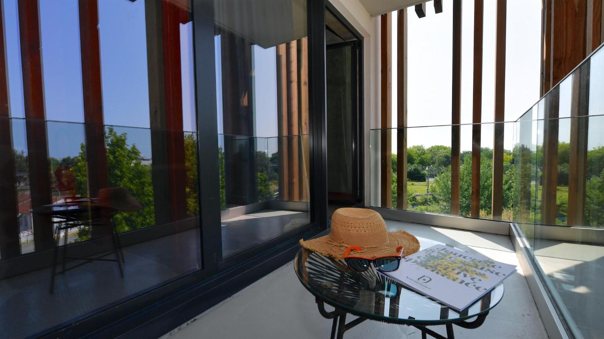 Superior Room with One Double Bed and Two Single Beds and Balcony