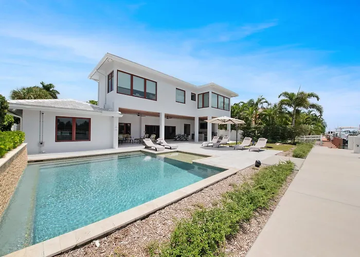Luxe Waterfront Villa Walk To Beach Pool And Gym
